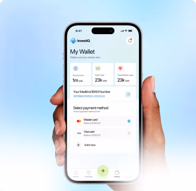 Smartphone held in two hands displaying InvestIQ wallet app showing total income, total case, market value, IBAN number, and payment method options including Mastercard and Visa.