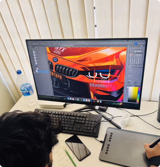 Person working on digital illustration of a vivid orange car front in graphic design software on a desktop computer.