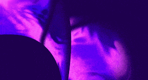 Purple and blue animated abstract shapes morphing and swirling in a fluid motion.